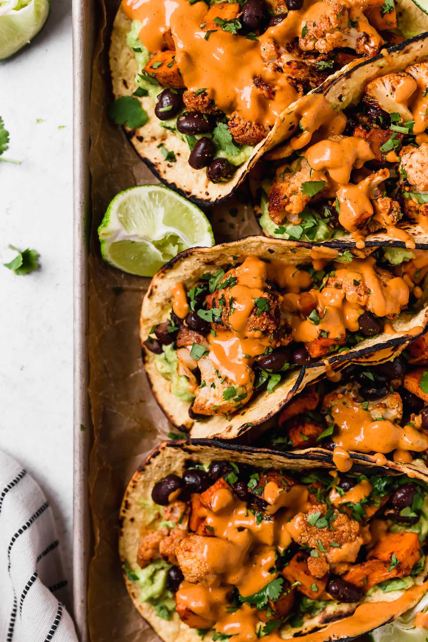 Roasted Sweet Potato and Cauliflower Tacos with Chipotle Cashew Crema